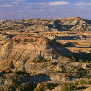 USA, North Dakota, Theodore Roosevelt National Park, Evening light defines eroded