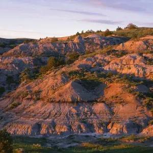 USA, North Dakota, Theodore Roosevelt National Park, Sunset light defines eroded