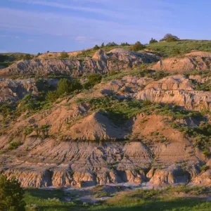 USA, North Dakota, Theodore Roosevelt National Park, Evening light defines eroded