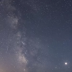 USA, Oregon, Bandon Beach. Lunar eclipse and Milky Way at night