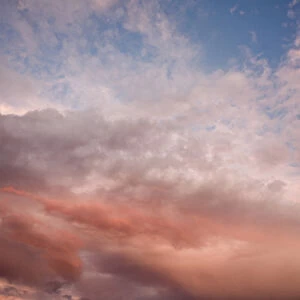USA, Oregon, Bend. Salmon-colored clouds dissolve into the evening sky in Bend, Oregon