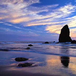 USA, Oregon. Cannon Beach at sunset low tide