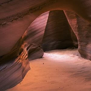 USA, Utah, Escalante Wilderness. A sandstone arch inside a slot canyon