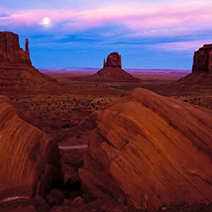 USA, Utah, Monument Valley. Moonrise over sandstone formations in valley. Credit as