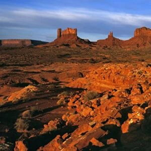 USA, Utah, Monument Valley. Sunset light throws long shadows on the buttes of Monument Valley, Utah