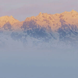 USA, Washington, Mount Constance. Foggy sunrise panorama of mountain