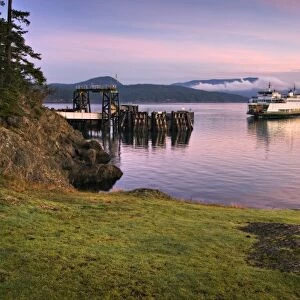 USA, Washington, San Juan Islands. A ferry at the Lopez Island dock at sunrise