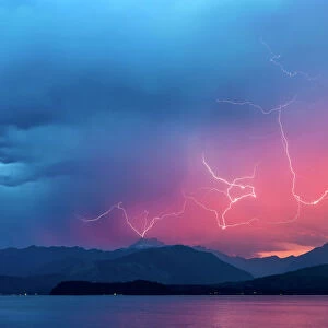 USA, Washington, Seabeck. Lightning over Hood Canal and Olympic Mountains. Credit as