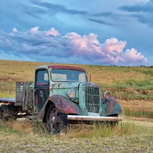 USA, Washington State. Old truck in field with beautiful clouds USA, Washington State. Old truck in field with beautiful clouds