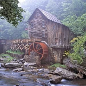 USA, West Virginia, Babcock SP. A ghostly fog clings to the Glade Creek Grist Mill