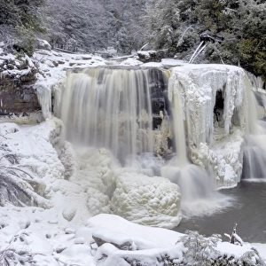 USA, West Virginia, Blackwater Falls State Park. Waterfall in winter landscape. Credit as
