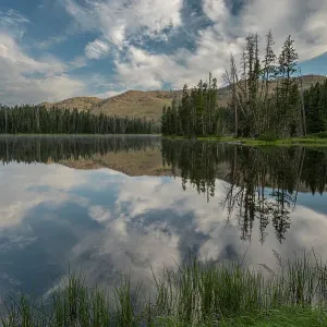 USA, Wyoming. Clouds reflected in Sylvan Lake, Yellowstone National Park USA, Wyoming. Clouds reflected in Sylvan Lake, Yellowstone National Park
