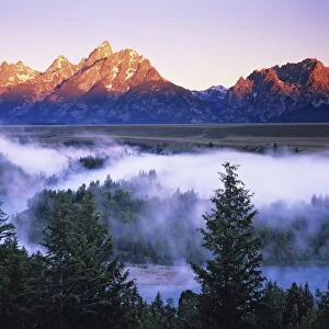 USA, Wyoming, Grand Teton Mountains. Misty mountain scenic seen from the Snake River
