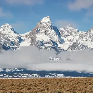 USA, Wyoming, Jackson. Grand Teton National Park, Panoramic view of fog hovering beneath the Teton Range USA, Wyoming, Jackson. Grand Teton National Park, Panoramic view of fog hovering beneath the Teton Range