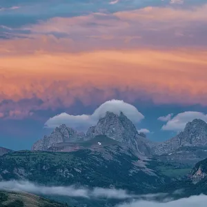 USA, Wyoming. Sunset and stratus clouds over Teton Range from the west USA, Wyoming. Sunset and stratus clouds over Teton Range from the west