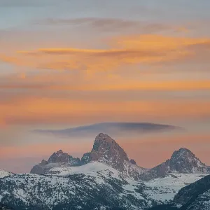 USA, Wyoming. Sunset over Teton Range from the west with cirrus and lenticular clouds USA, Wyoming. Sunset over Teton Range from the west with cirrus and lenticular clouds