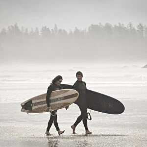 Vancouver Island, Pacific Rim National Park. Surfers on the beach