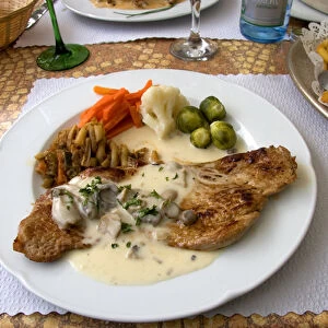Veal with a cream sauce served at a sidewalk restaurant in Ribeauville, France