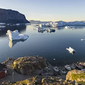View of fjord full of icebergs towards Nuussuaq peninsula during midnight sun