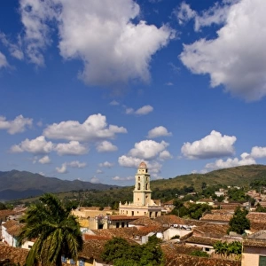 View from above with great clouds of the old Colonial village of Trinidad Cuba buildings