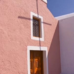 Village of Oia, with a pink church on the cliff