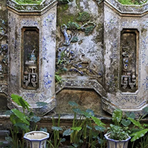 The wall of an inside courtyard in Quan Thang House in Hoi An, Vietnam