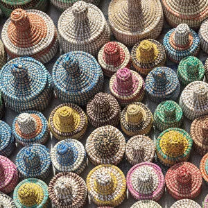 West Africa, The Gambia, Banjul. A collection of colorful woven baskets viewed from above