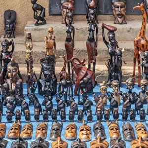 West Africa, The Gambia, Banjul. Wooden masks, animals, and other crafts for sale