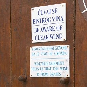 Winery with self service selling buying of the wine. Warning sign saying beware of