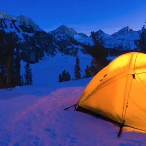 Yellow dome tent in winter, John Muir Wilderness, Sierra Nevada Mountains, California USA