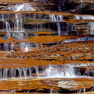 Zion National Park, Utah. USA. North Creek cascades over sandstone ledges