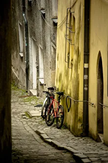 Bicycle Prints: 2 bicycles on cobblestone street, Passau, Germany