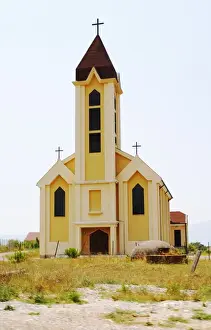 Bucolic Prints: An abandoned church in the countryside. In font of the church a typical Albanian