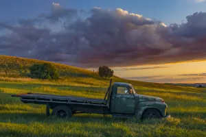 Palouse Prints: Abandoned truck on hillside at sunset, Palouse region of eastern Washington