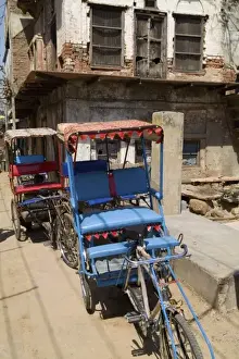 Undeveloped Prints: Abstract bicycle rickshaw on rugged street of the religious village of Mathura India