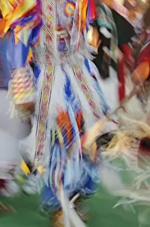 Dance Prints: Abstract motion view of colorfully dressed Native American Indian dance, Montana