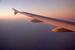 Aerial view of the Andes in Argentina at sunrise throught the window of an airplane