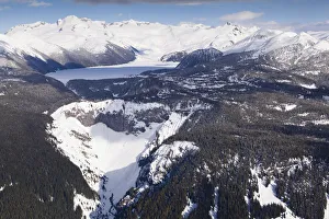 Barrier Prints: Aerial view of frozen Garibaldi Lake and lava barrier in the foreground