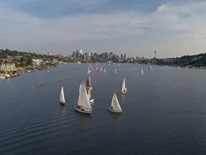 Lake Union Prints: Aerial view of sailboats racing on Lake Union in the evening with the Seattle skyline in