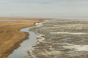 aerial view of spring ice breakup along the coast east of Point Barrow, National Petroleum Reserves