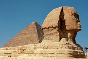 Images Dated 8th April 2024: Africa, Egypt, Giza. Classic view of the Sphinx and one of the great Pyramids of Giza