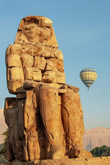 Images Dated 8th April 2024: Africa, Egypt, Luxor. Hot air balloon's travel over the Valley of the Kings at sunrise