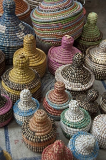 Africa, Gambia. Capital city of Banjul. Colorful hand made straw baskets
