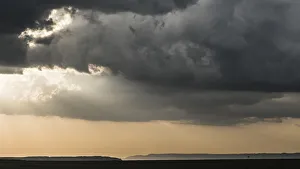 Images Dated 24th January 2018: Africa, Kenya, Msai Mara National Reserve. Storm clouds over savannah at sunset