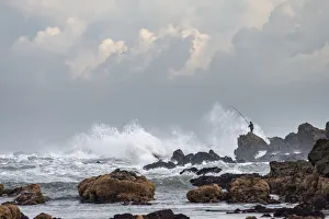 Casablanca Prints: Africa, Morocco, Casablanca. Man fishing amid ocean waves