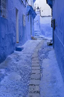 Morocco Collection: Africa, Morocco, Chefchaouen. A quiet alleyway in blue, the typical paint color of