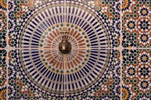Africa, Morocco. Close-up of tile design patterns around faucet