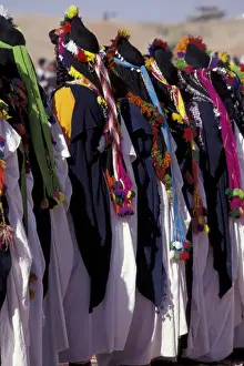 Dance Prints: Africa, Morocco, El Kelaa des Mgouna Woman in traditional dress dancing at Festival of Roses