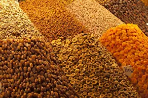 Marrakech Prints: Africa, Morocco, Marrakech. Dried fruits and nuts are artfully stacked in a stall