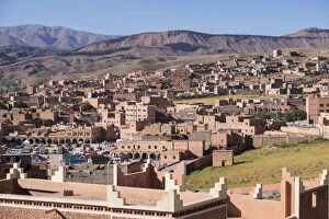 Africa, Morocco. The town of Boulmalne du Dades spills up the hillsides of the Atlas